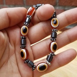 Orange brown evil eye bead bracelet